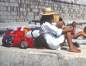 girl sitting with backpacks